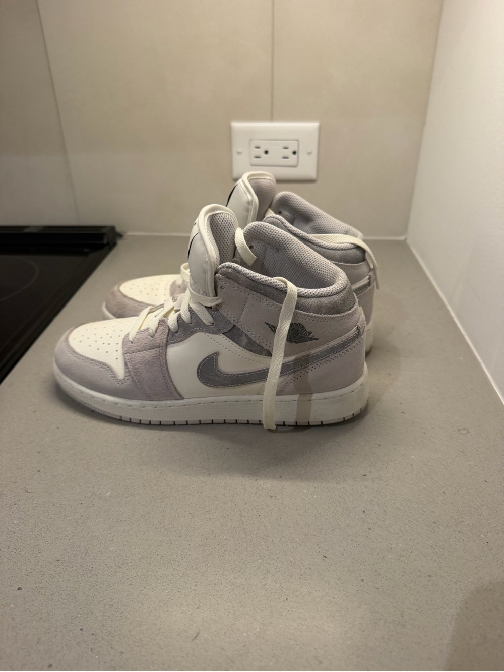 Jordan Women’s High-Top Sneakers in White and Light Gray